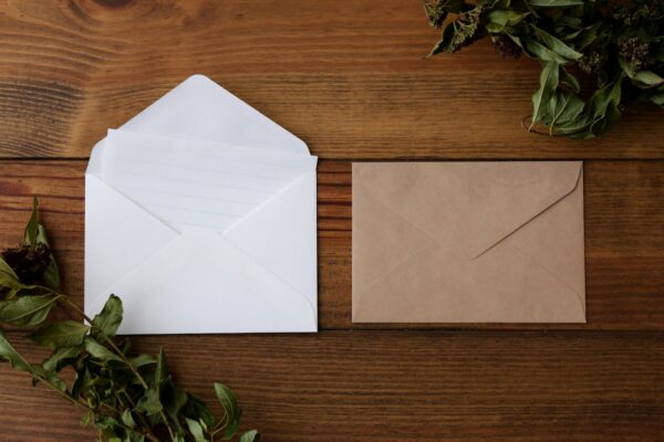 Two open envelopes on a table